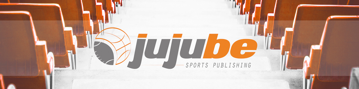 Orange stadium seating with the Jujube Sports Publishing logo in the center. The Jujube Sports Publishing logo is lowercase lettering in orange and grey with a circle that is part football and part basketball.